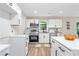 Renovated kitchen featuring white cabinets and stainless steel appliances at 1836 Meadow Ln, Decatur, GA 30032