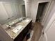 Double vanity bathroom with granite countertops and bath at 221 Overlook Rd, Covington, GA 30014
