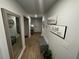 Bright and spacious entryway with a bench, mirror, and wood flooring at 221 Overlook Rd, Covington, GA 30014