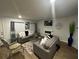 Living room features a fireplace, comfy seating, and a large TV at 221 Overlook Rd, Covington, GA 30014
