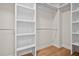 Spacious closet with built-in shelves and hanging rods at 2848 Tanner Lake Nw Trl, Marietta, GA 30064