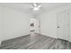 Bright bedroom with grey wood-look floors and ample closet space at 3968 Blanton Sw Ave, Atlanta, GA 30331