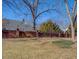 Landscaped backyard with brick wall at 5143 Floyd Ne St, Covington, GA 30014