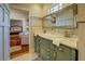 Bathroom with double vanity, marble countertop, and shower at 5143 Floyd Ne St, Covington, GA 30014