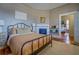 Bedroom with a metal bed frame and hardwood floors at 5143 Floyd Ne St, Covington, GA 30014