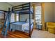 Bedroom with a bunk bed and hardwood floors at 5143 Floyd Ne St, Covington, GA 30014