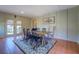 Bright dining room with hardwood floors and French doors leading to the patio at 5143 Floyd Ne St, Covington, GA 30014