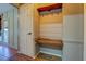 Convenient drop zone with bench seating and hooks for coats at 5143 Floyd Ne St, Covington, GA 30014