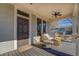Spacious front porch with seating area and a view of the street at 5143 Floyd Ne St, Covington, GA 30014