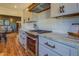 Modern kitchen with stainless steel appliances and granite countertops at 5143 Floyd Ne St, Covington, GA 30014