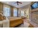 Main bedroom with hardwood floors and brick fireplace at 5143 Floyd Ne St, Covington, GA 30014