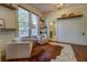Sitting area with hardwood floors and two armchairs at 5143 Floyd Ne St, Covington, GA 30014