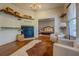 Sitting room with hardwood floors, fireplace, and built-in shelving at 5143 Floyd Ne St, Covington, GA 30014