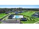 Aerial view of the community pool, playground, clubhouse, and new construction homes at 8589 Seabiscuit Rd, Lithonia, GA 30058