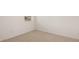 Bright bedroom with neutral carpeting, offering a simple and adaptable space at 8589 Seabiscuit Rd, Lithonia, GA 30058
