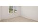Cozy bedroom with a window and carpeted floor at 8589 Seabiscuit Rd, Lithonia, GA 30058