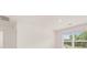 The bedroom features a bright window and modern lighting at 8589 Seabiscuit Rd, Lithonia, GA 30058