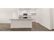 Bright kitchen showcasing white cabinets, granite countertops, and stainless steel appliances at 8589 Seabiscuit Rd, Lithonia, GA 30058