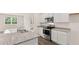 Well-lit kitchen equipped with stainless steel appliances and granite countertops at 8589 Seabiscuit Rd, Lithonia, GA 30058