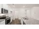 Updated kitchen offering granite countertops and stainless steel appliances at 8589 Seabiscuit Rd, Lithonia, GA 30058