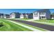 A street view featuring sidewalks, new construction homes, and green lawns at 8589 Seabiscuit Rd, Lithonia, GA 30058