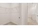 Spacious walk-in closet featuring wire shelving, carpeted floor, and ample storage space at 8589 Seabiscuit Rd, Lithonia, GA 30058