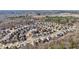 This aerial view shows residential community surrounded by forest and a quarry far in the distance at 1565 Horseshoe Creek Ln, Cumming, GA 30041