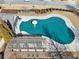 Aerial view of a community pool covered for the off-season, with a pergola and patio area at 1565 Horseshoe Creek Ln, Cumming, GA 30041