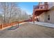 Fenced backyard featuring a soccer net and multi-level deck with stairs to the upper level at 1565 Horseshoe Creek Ln, Cumming, GA 30041