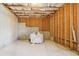 Unfinished basement with exposed ceiling insulation and wood framing, offering potential for customization at 1565 Horseshoe Creek Ln, Cumming, GA 30041