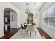 Bright dining area with wood floors, modern light fixture, table and chairs at 1565 Horseshoe Creek Ln, Cumming, GA 30041