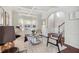 Bright formal living room with bay window, hardwood floors, stylish furniture, and an arched doorway at 1565 Horseshoe Creek Ln, Cumming, GA 30041