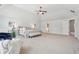 Expansive main bedroom with vaulted ceilings, seating area, and neutral decor at 1565 Horseshoe Creek Ln, Cumming, GA 30041