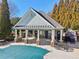 Close up of pool house with bathrooms and seating area at 1565 Horseshoe Creek Ln, Cumming, GA 30041