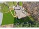 An aerial view of the house showing its roof, backyard, landscaping, and surrounding trees at 3611 Howell Wood Trl, Duluth, GA 30096