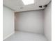 Unfinished basement with concrete block walls, grey flooring and a white ceiling at 3611 Howell Wood Trl, Duluth, GA 30096