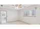 Bedroom featuring a large window and neutral carpet flooring at 3611 Howell Wood Trl, Duluth, GA 30096