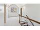 Hallway features arched window, stairwell with wood rail, and access to other rooms at 3611 Howell Wood Trl, Duluth, GA 30096