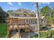 The home has an elevated back porch with stairs leading down to the backyard area at 3611 Howell Wood Trl, Duluth, GA 30096