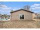 Tan colored home with sliding glass doors at 546 Paden Dr, Lawrenceville, GA 30044