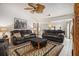 Relaxing living room with leather sofas, a large TV and fireplace at 546 Paden Dr, Lawrenceville, GA 30044