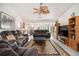 Relaxing living room with leather sofas, a large TV and fireplace at 546 Paden Dr, Lawrenceville, GA 30044