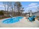 Inviting kidney-shaped pool with patio and fire pit at 546 Paden Dr, Lawrenceville, GA 30044