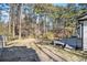 Private backyard with deck and wooded area at 6492 Swift Creek Rd, Lithonia, GA 30058