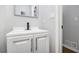 Simple bathroom with white vanity and modern fixtures at 6492 Swift Creek Rd, Lithonia, GA 30058