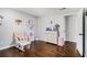 bedroom with dresser and hardwood floors at 6492 Swift Creek Rd, Lithonia, GA 30058