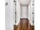 Hallway with hardwood floors and neutral walls at 6492 Swift Creek Rd, Lithonia, GA 30058