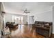 Living room with hardwood floors, fireplace, and large window at 6492 Swift Creek Rd, Lithonia, GA 30058