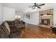 Living room with hardwood floors, fireplace, and sectional sofa at 6492 Swift Creek Rd, Lithonia, GA 30058