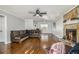 Living room with hardwood floors, fireplace, and sectional sofa at 6492 Swift Creek Rd, Lithonia, GA 30058